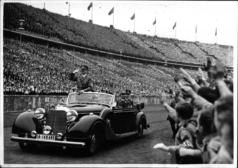 Adolf Hitler arrives in Berlin's Olympic stadium before his May Day speech to the Hitler Youth